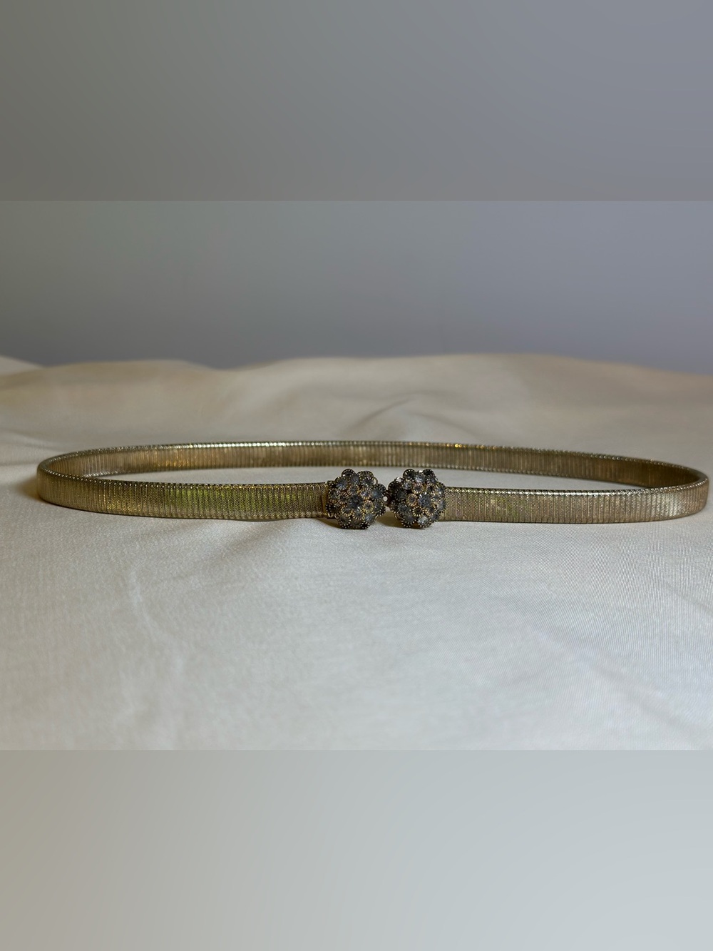 Vintage 1960’s gold tone stretch belt with crystal clasp